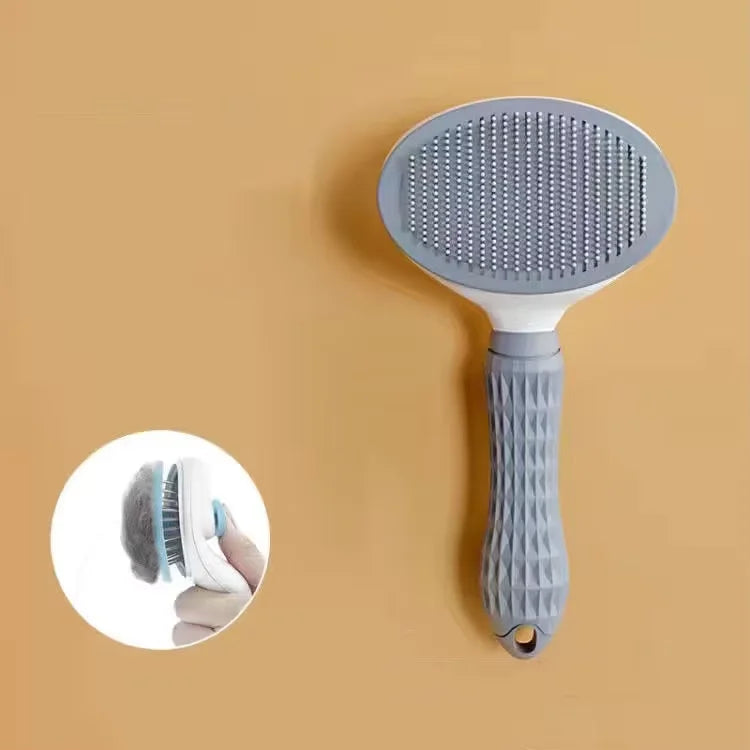 Stainless steel pet detangling comb in pink for long-haired dogs and cats
