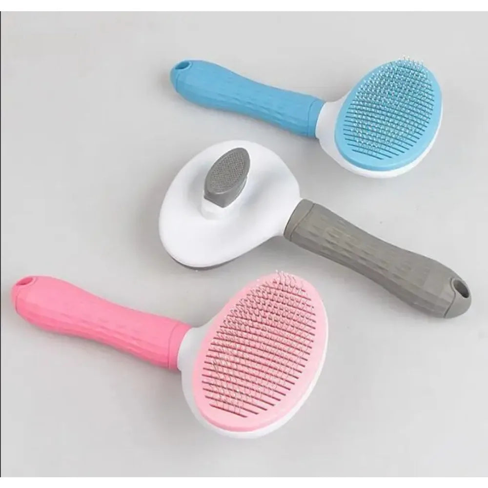 Stainless steel pet detangling comb in pink for long-haired dogs and cats